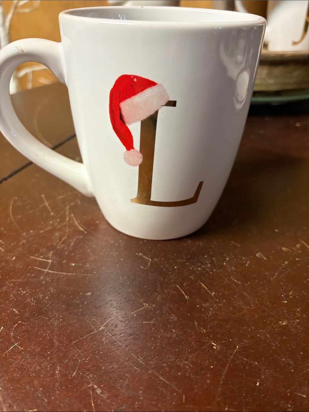 Home Essentials White Mug with Gold Letter L and Red Santa Hat